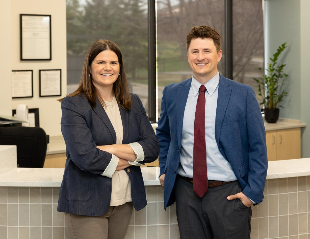 Dr. White and Dr. Gulis smiling in Front Lobby
