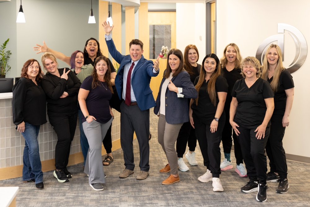 Integrity Dental Care Team Photo smiling and waving at camera