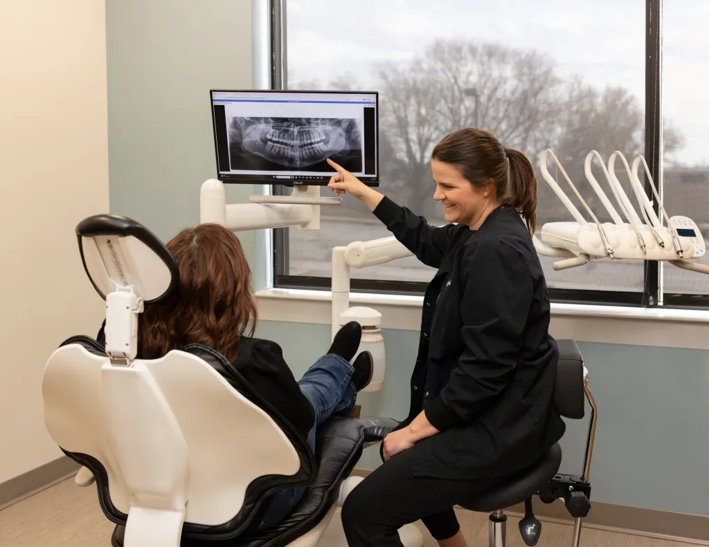 Dr. Gulis explaining dental x-ray to patient